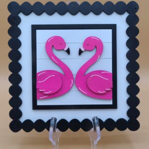 Flamingos facing each other